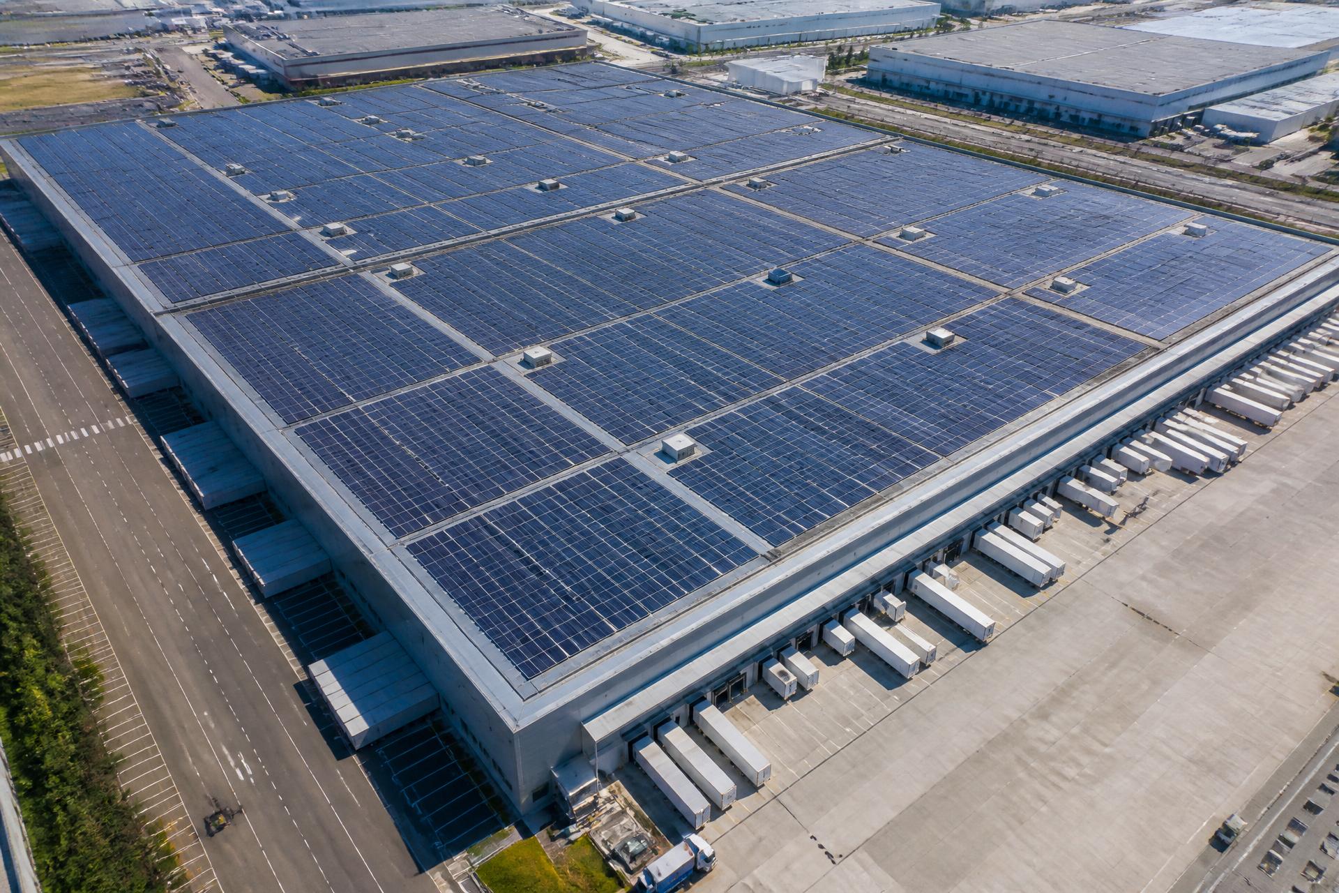 Aerial view of a large Australian distribution centre roof tiled edge to edge with solar panels